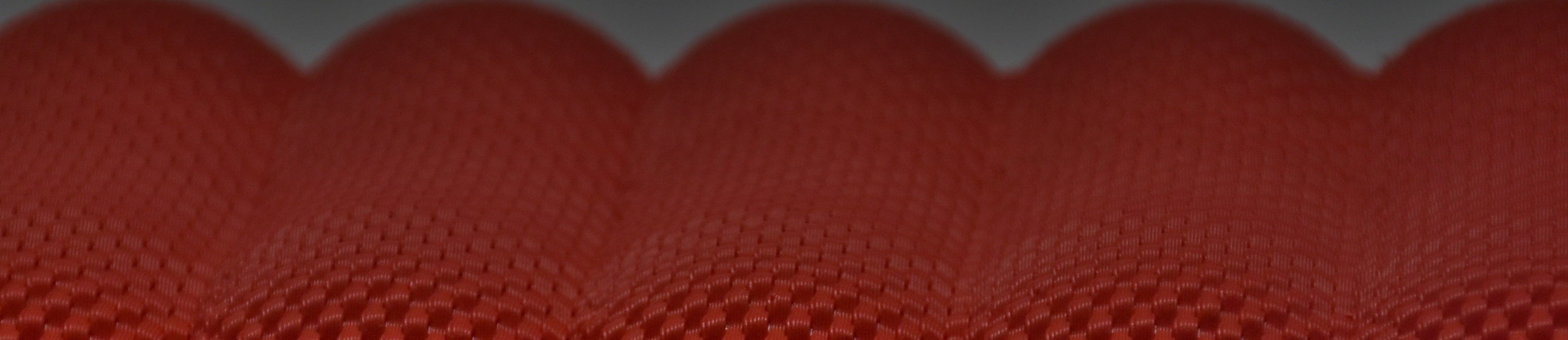 Macro texture of the ribbed lampshade surface, dark red